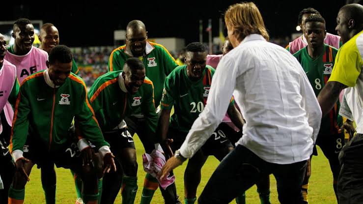 Hervé Renard dancing with his players