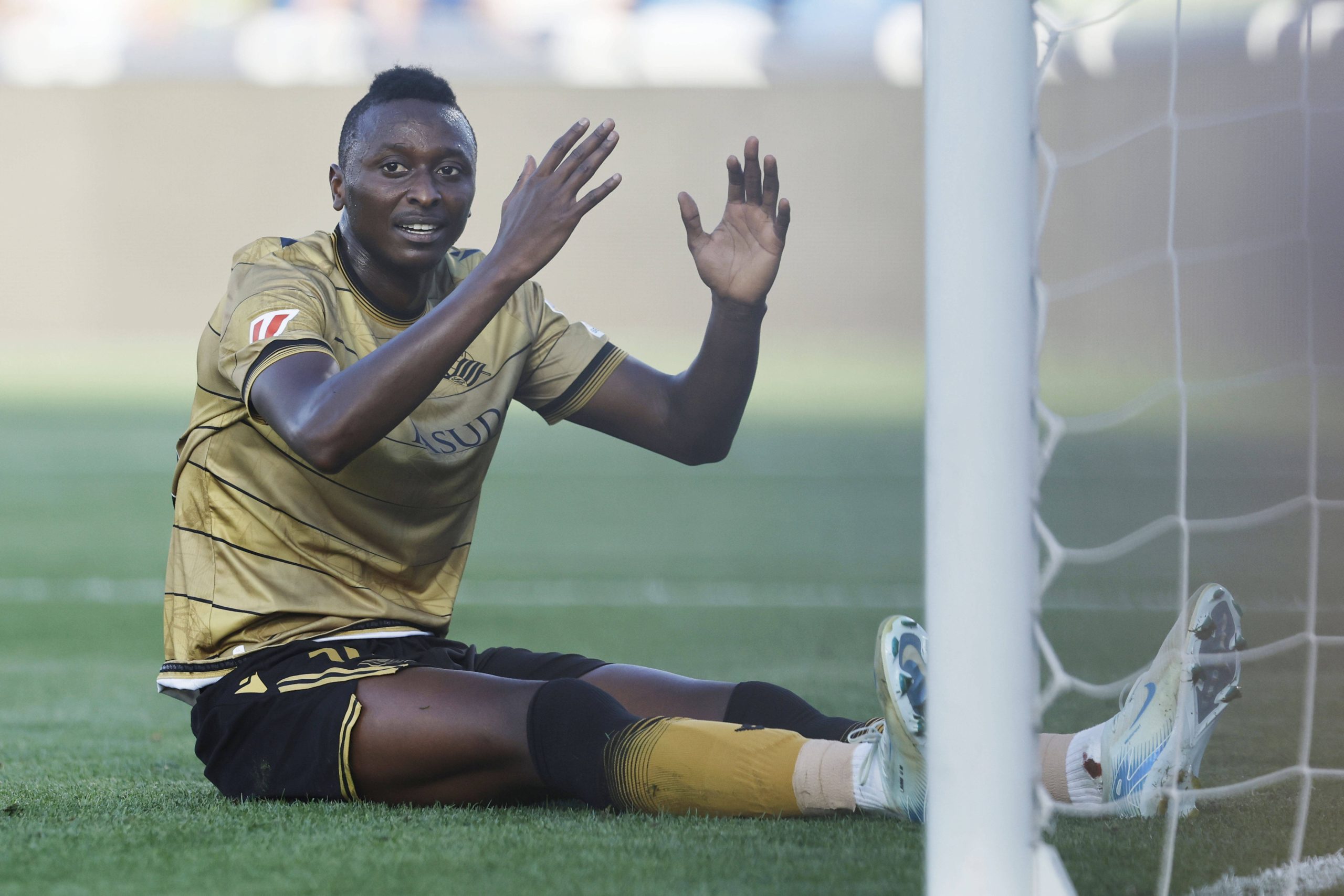 Sadiq Umar on the turf after missing a goal