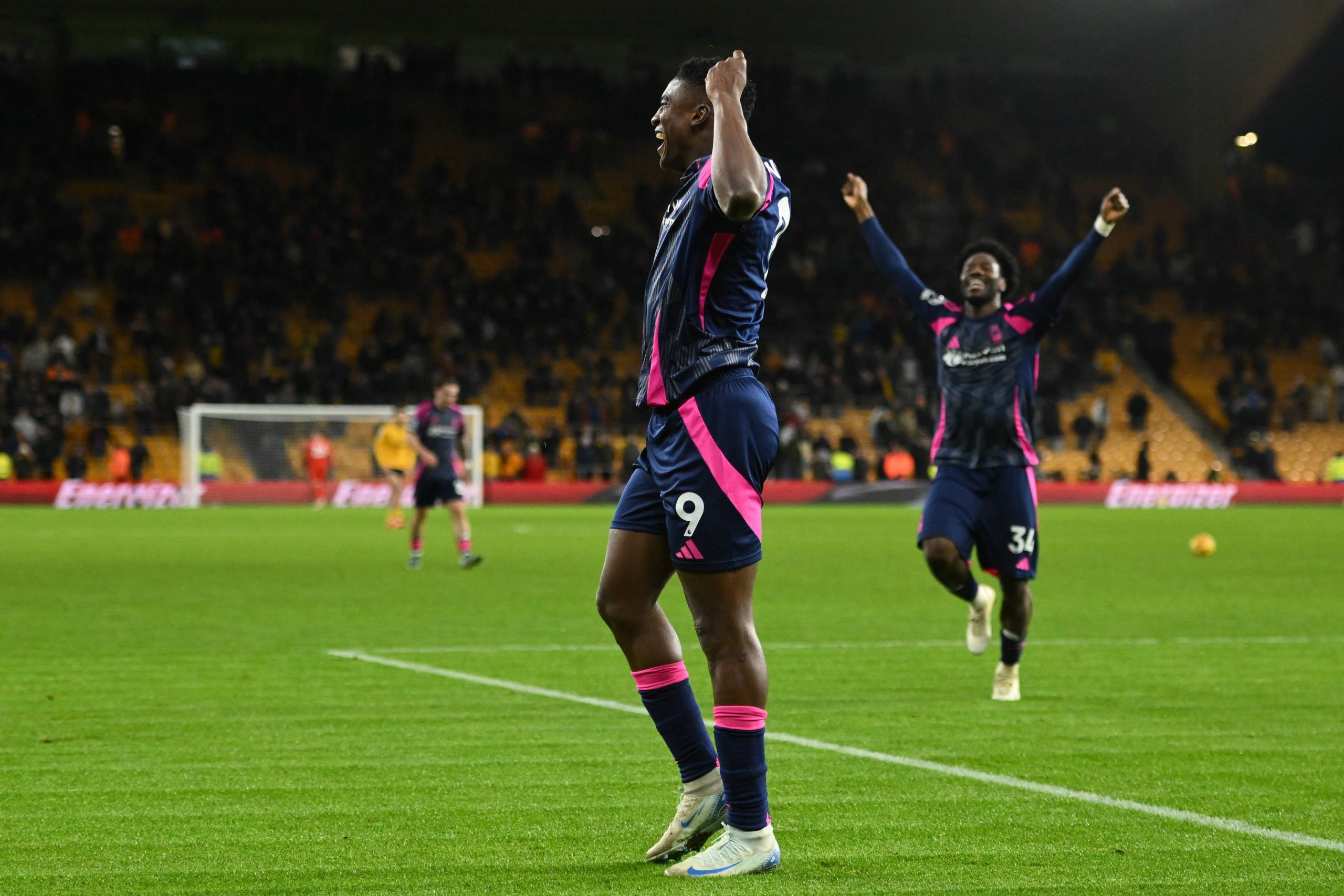 Ola Aina and Taiwo Awoniyi celebrates after scoring a goal to make it 0-3 during the Premier League match between Wolverhampton Wanderers and Nottingham Forest