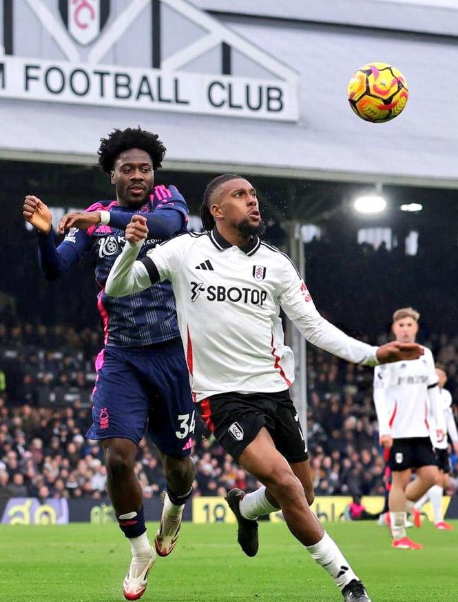 Nottingham Forest star Ola Aina challenges Fulham playmaker Alex Iwobi. Photo Credit X