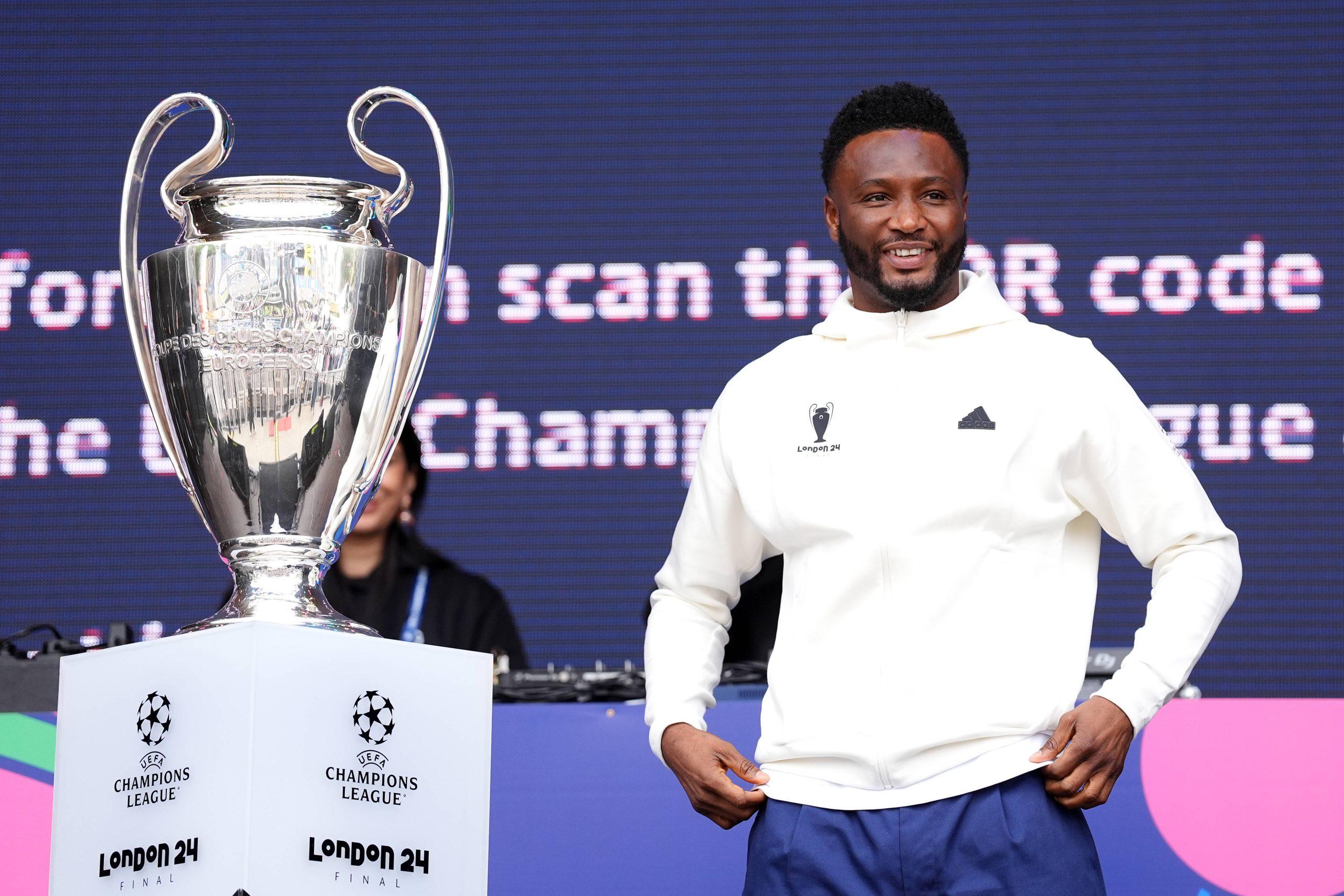 UEFA ambassador Mikel John Obi with the UEFA Champions League trophy