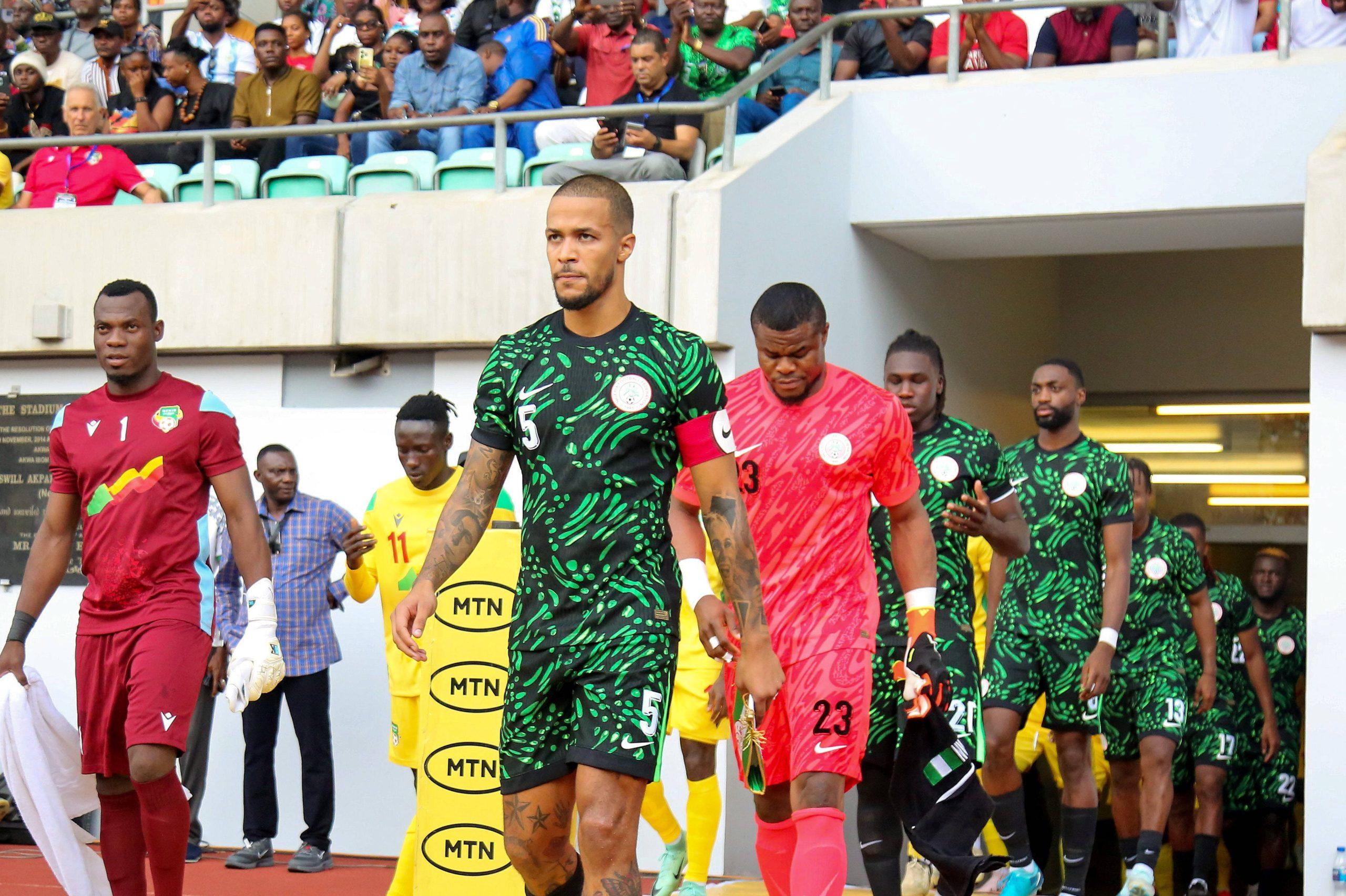 William Troost-Ekong and Stanley Nwabali leading out Nigeria Super Eagles.