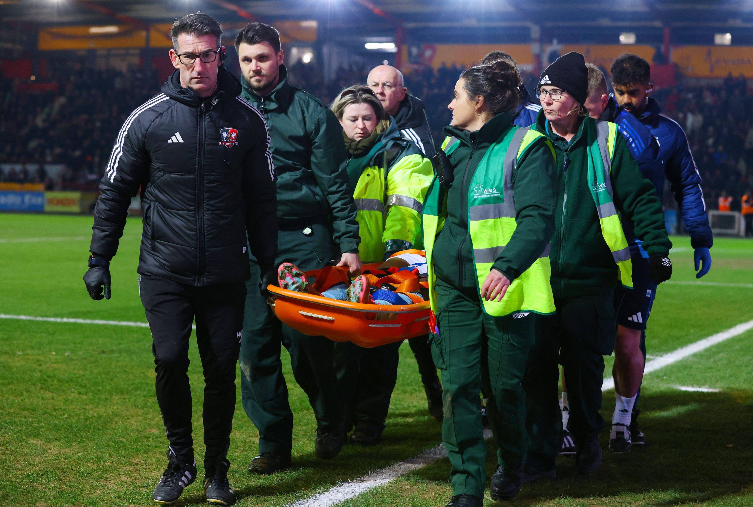 Taiwo Awoniyi being stretchered off