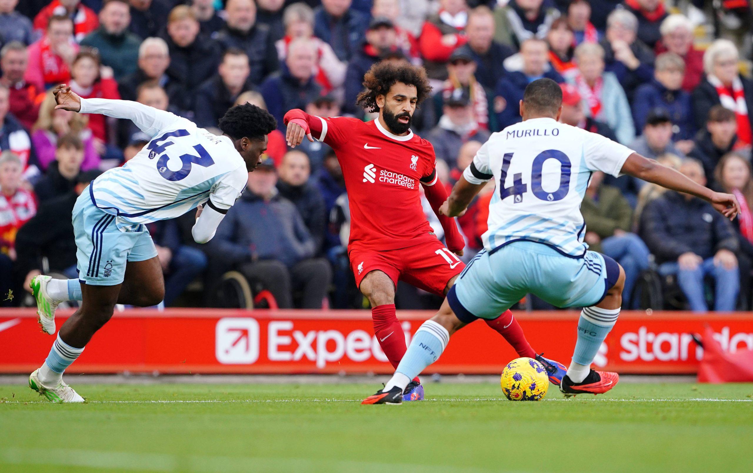 Mohamed Salah in action with Nottingham Forest s Ola Aina left and Murillo during the Premier League match at Anfield