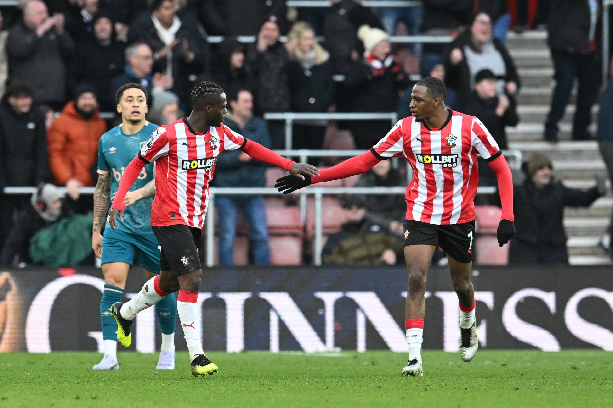 Kamaldeen Sulemana celebrates scoring a goal with Joe Aribo