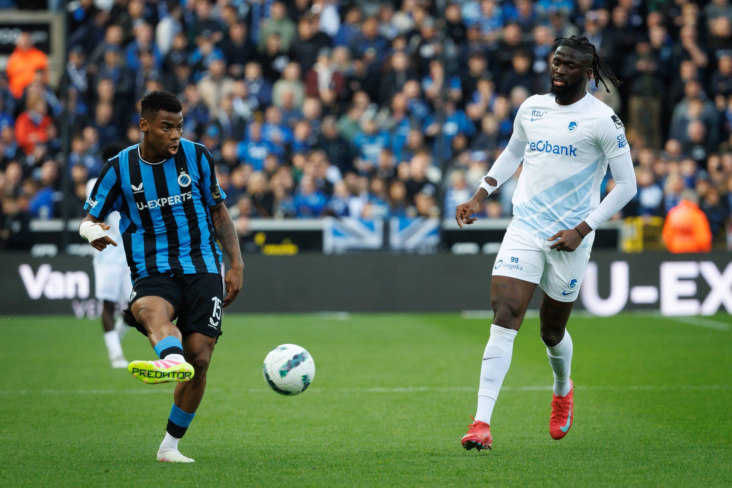 Raphael Onyedika and Toluwalase Arokodare fight for the ball