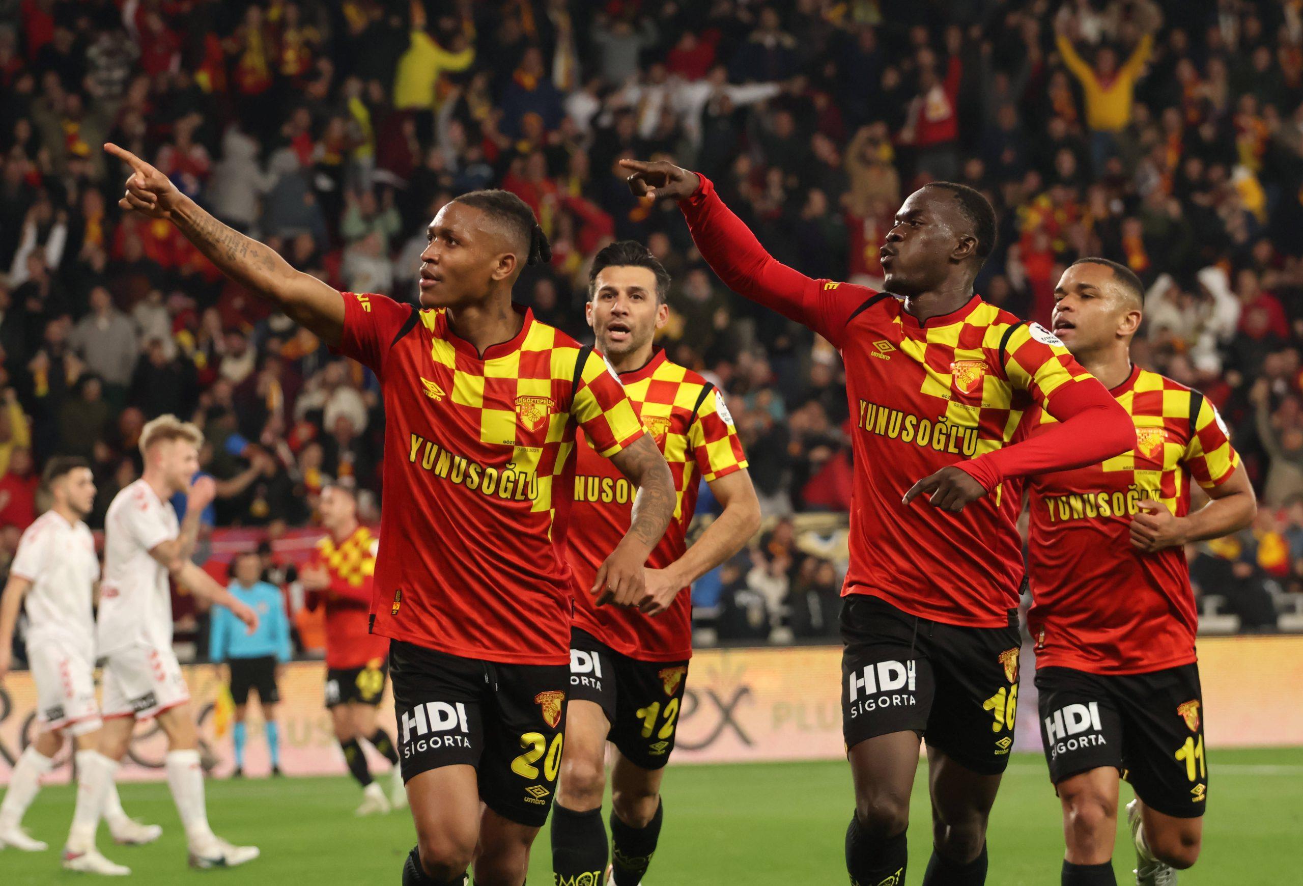 Novatus Miroshi 20 celebrates after scoring the first goal of his team with Anthony Dennis 16 during the Turkish Super League match between Goztepe and Samsunspor