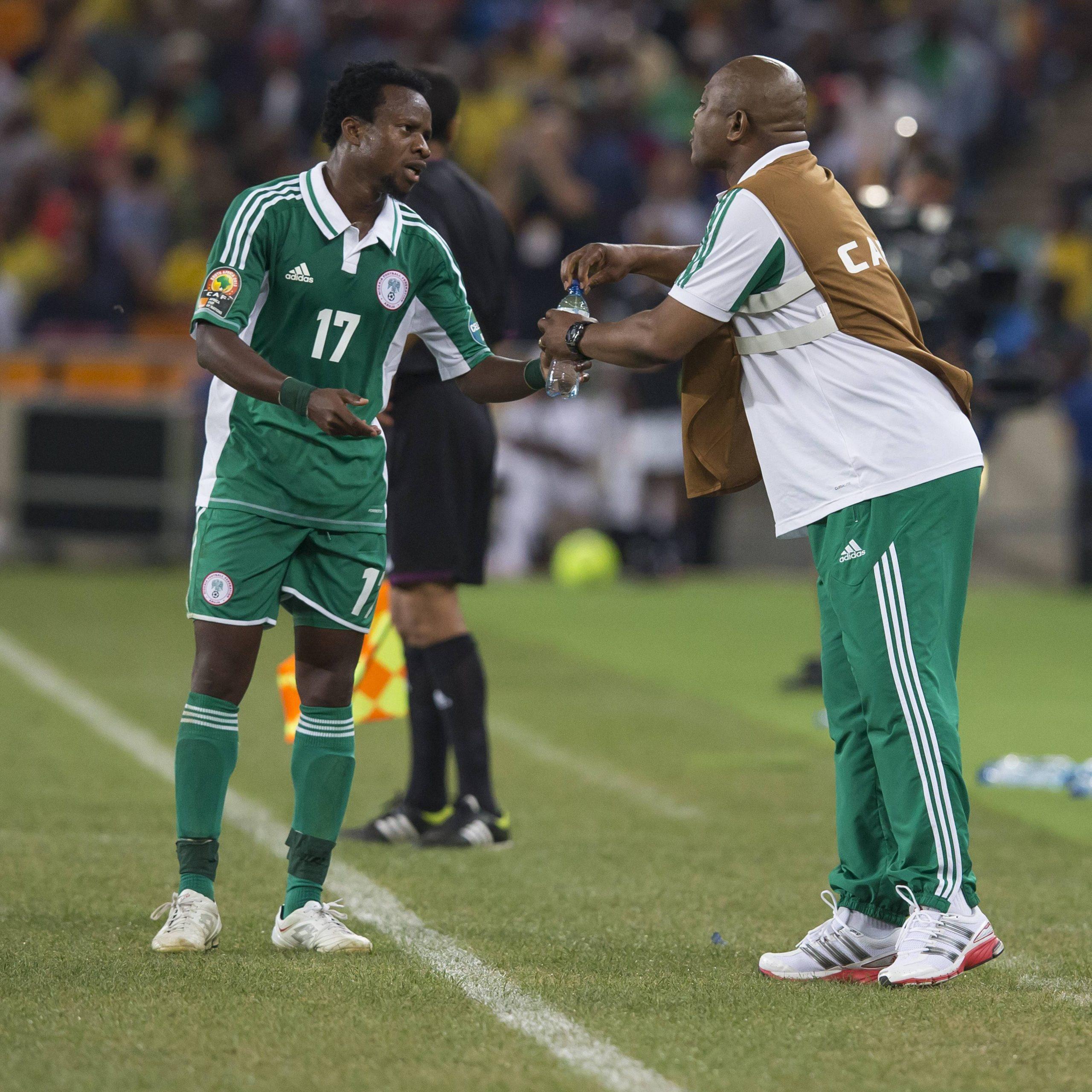 Former Lazio star Ogenyi Onazi from Nigeria and Stephen Keshi during the 2013 Orange African Cup of Nations