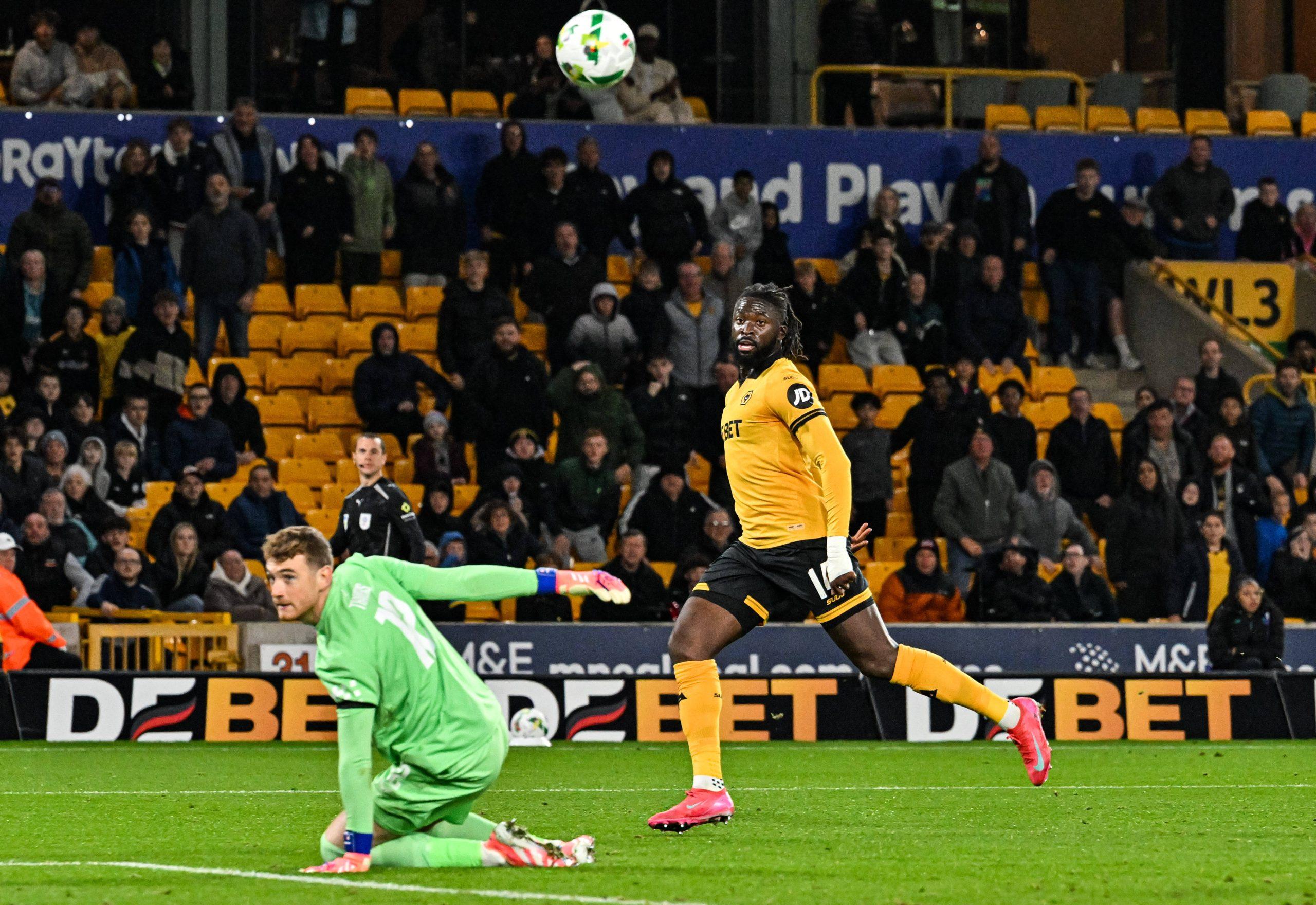 Tolu Arokodare watches his shot go over Mark Travers and into the net in the 87th minute to make the score 2-0 in the Carabao Cup game between Wolverhampton Wanderers and Everton at the Molineux