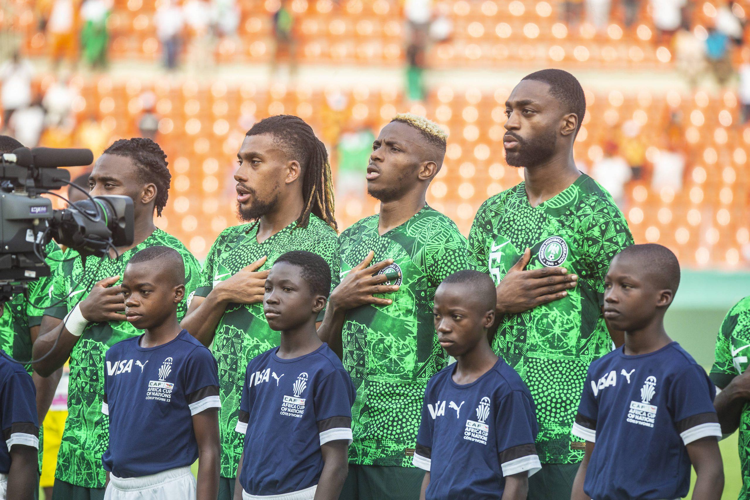 Super Eagles players, Iwobi, Victor Osimhren and Semilore Ajayi during the National Anthem of the game between Nigeria vs South Africa