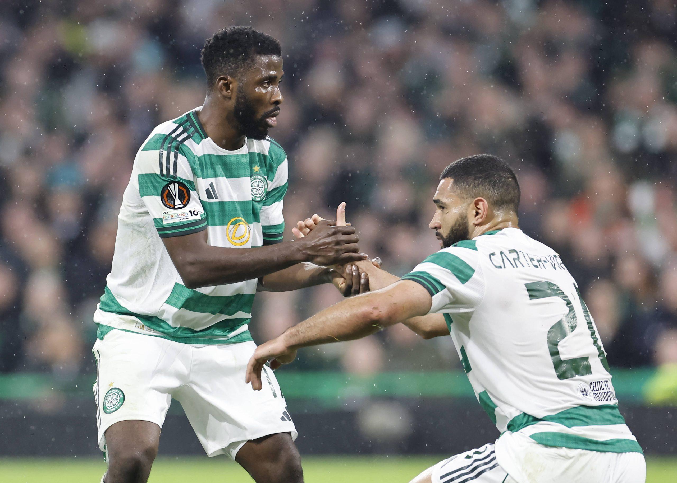 Kelechi Iheanacho helps Cameron Carter-Vickers to his feet during the UEFA Europa League match at Celtic Park