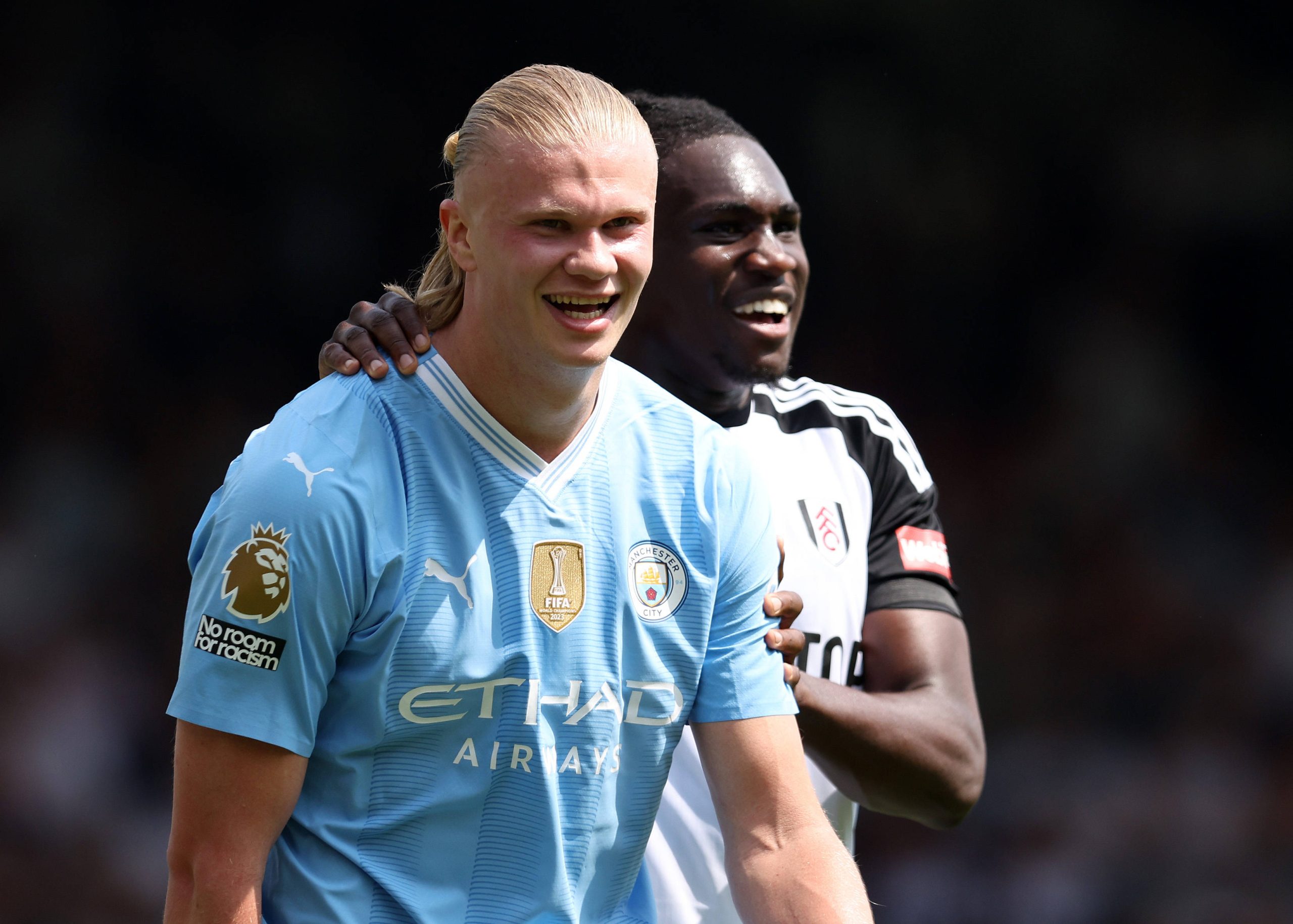 Erling Haaland and Calvin Bassey of Fulham during the Premier League