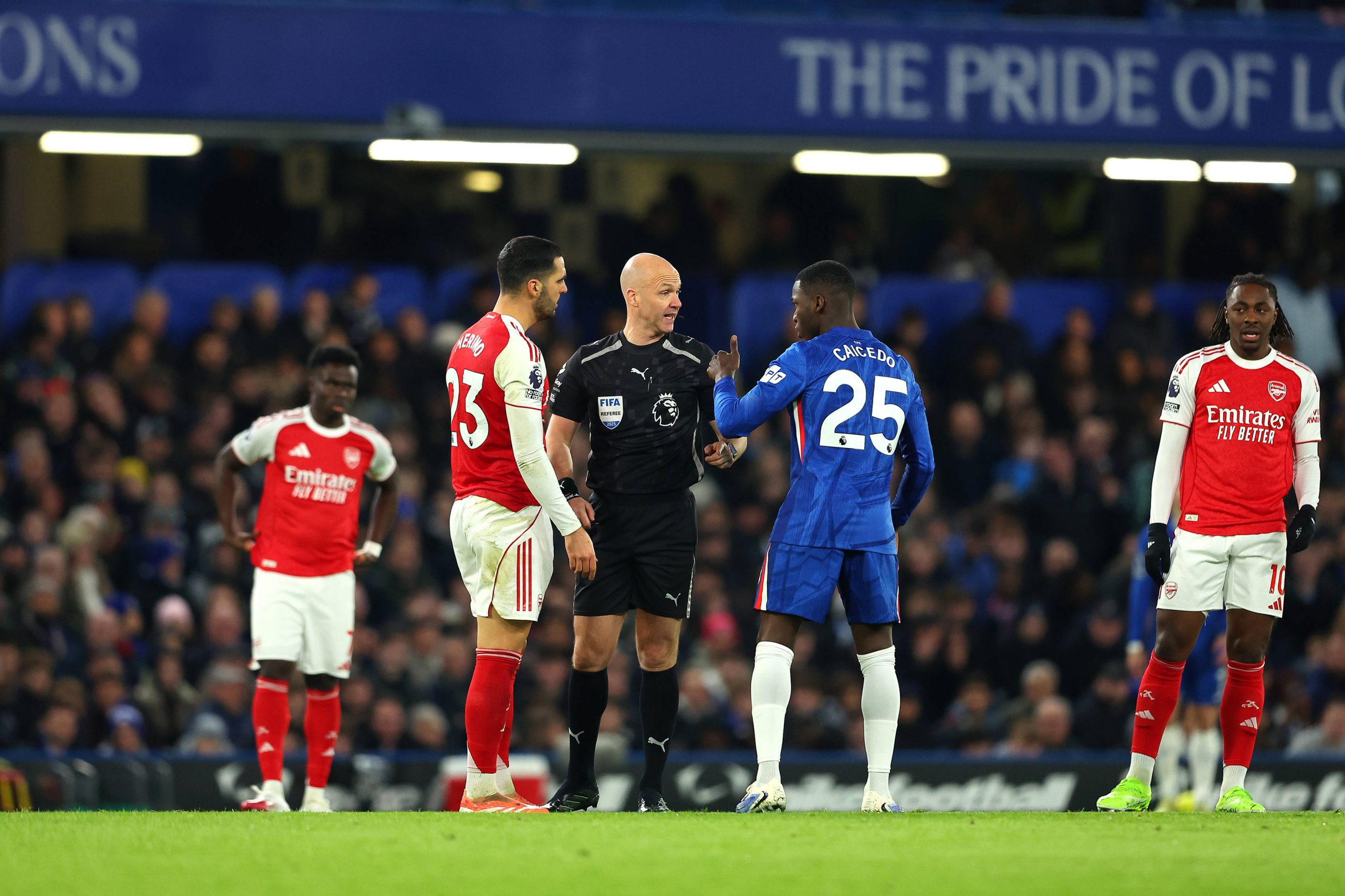 Referee Anthony Taylor having a word with Moises Caicedo after tackling Mikel Merino in Chelsea's 1-1 draw against Arsenal