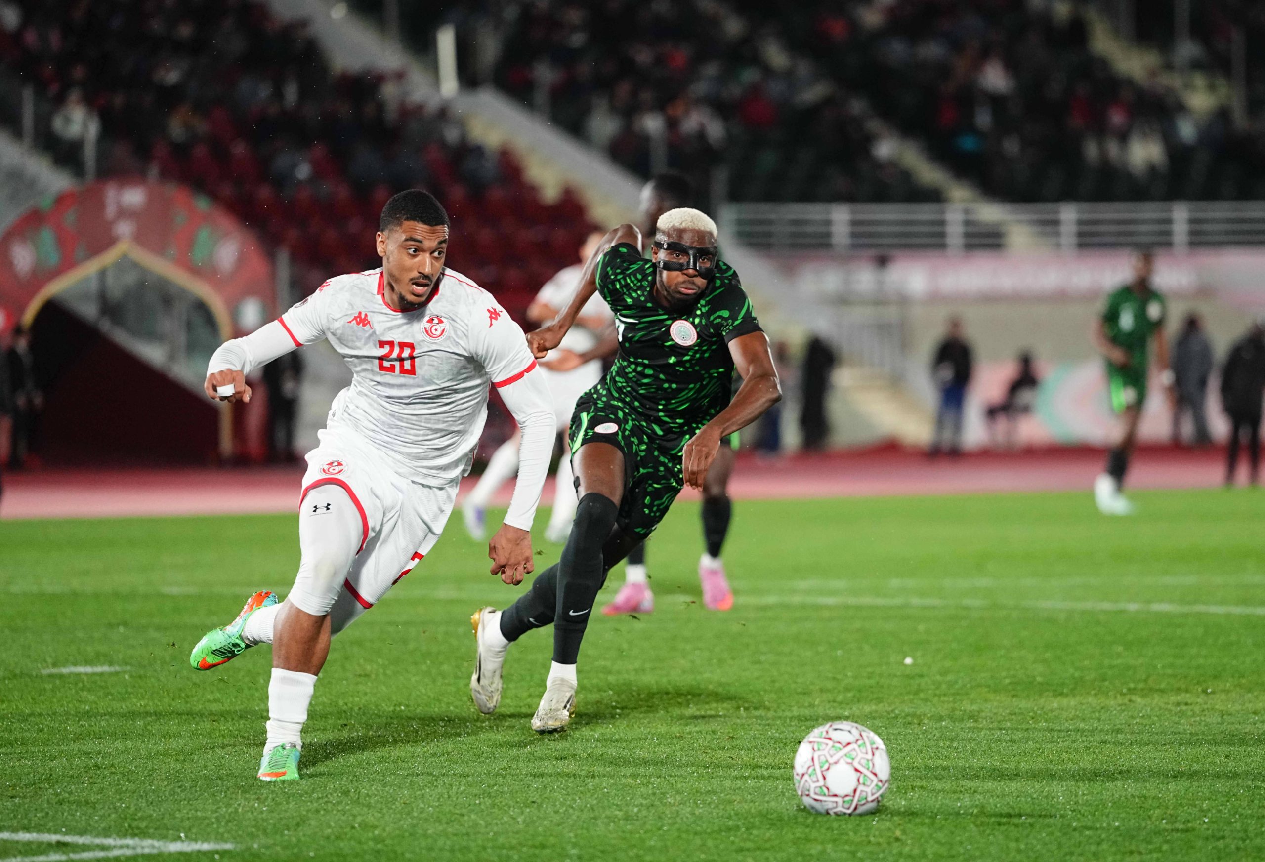 Valery Yan and Victor James Osimhen battle for the ball during the Africa Cup Of Nations match between Tunisia and Nigeria