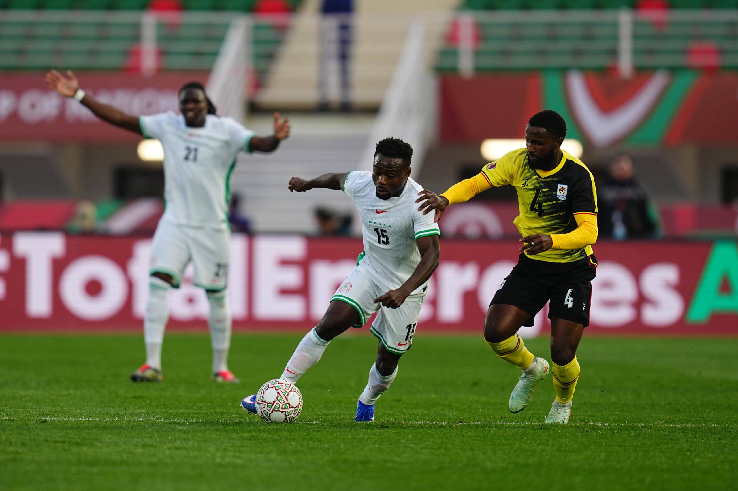Kenneth Semakula and Moss Daddy-Ajala Simon battle for the ball during the Africa Cup Of Nations match between Uganda and Nigeria