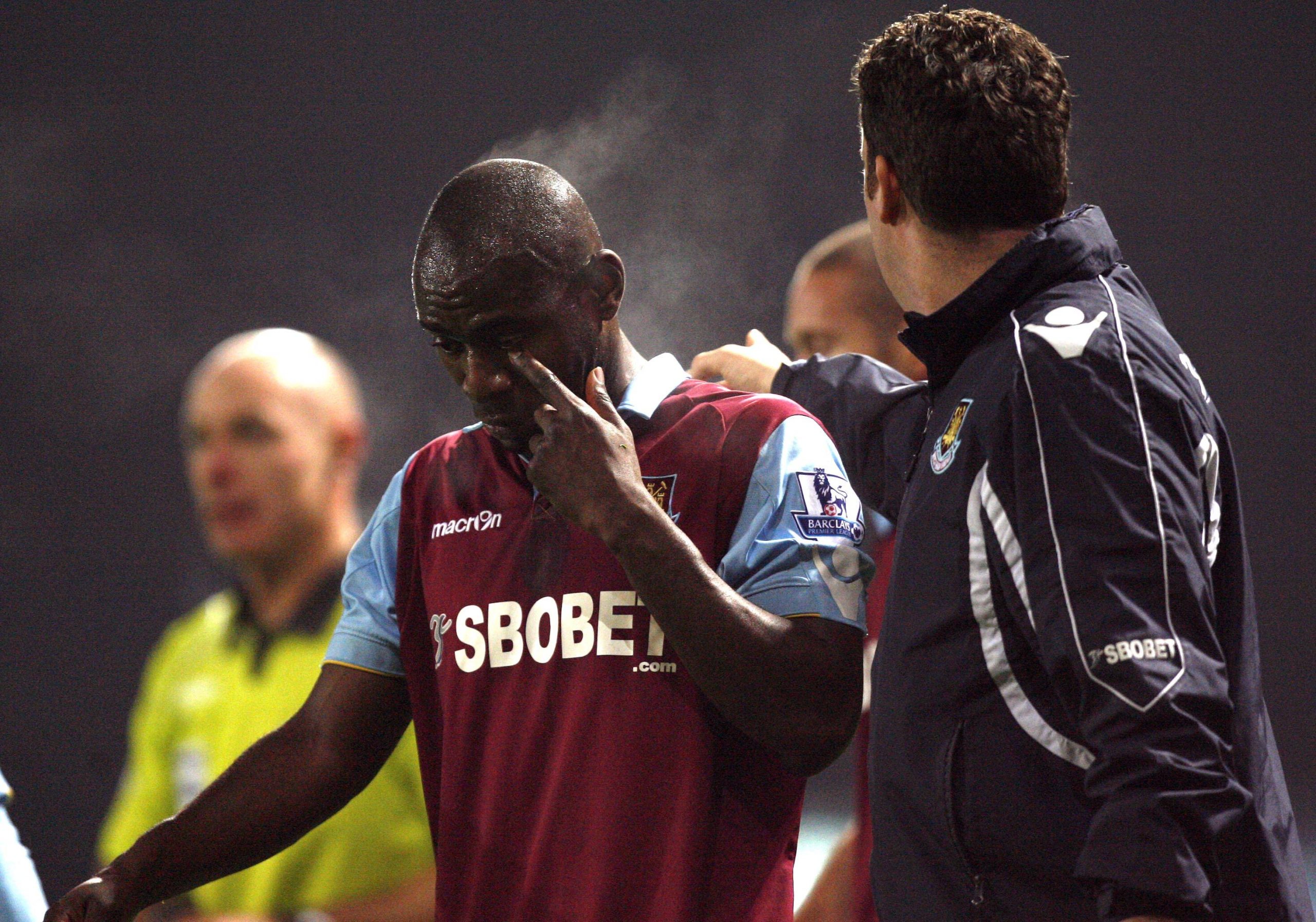 A dejected Herita Ilunga of West Ham United leaves the field injured
