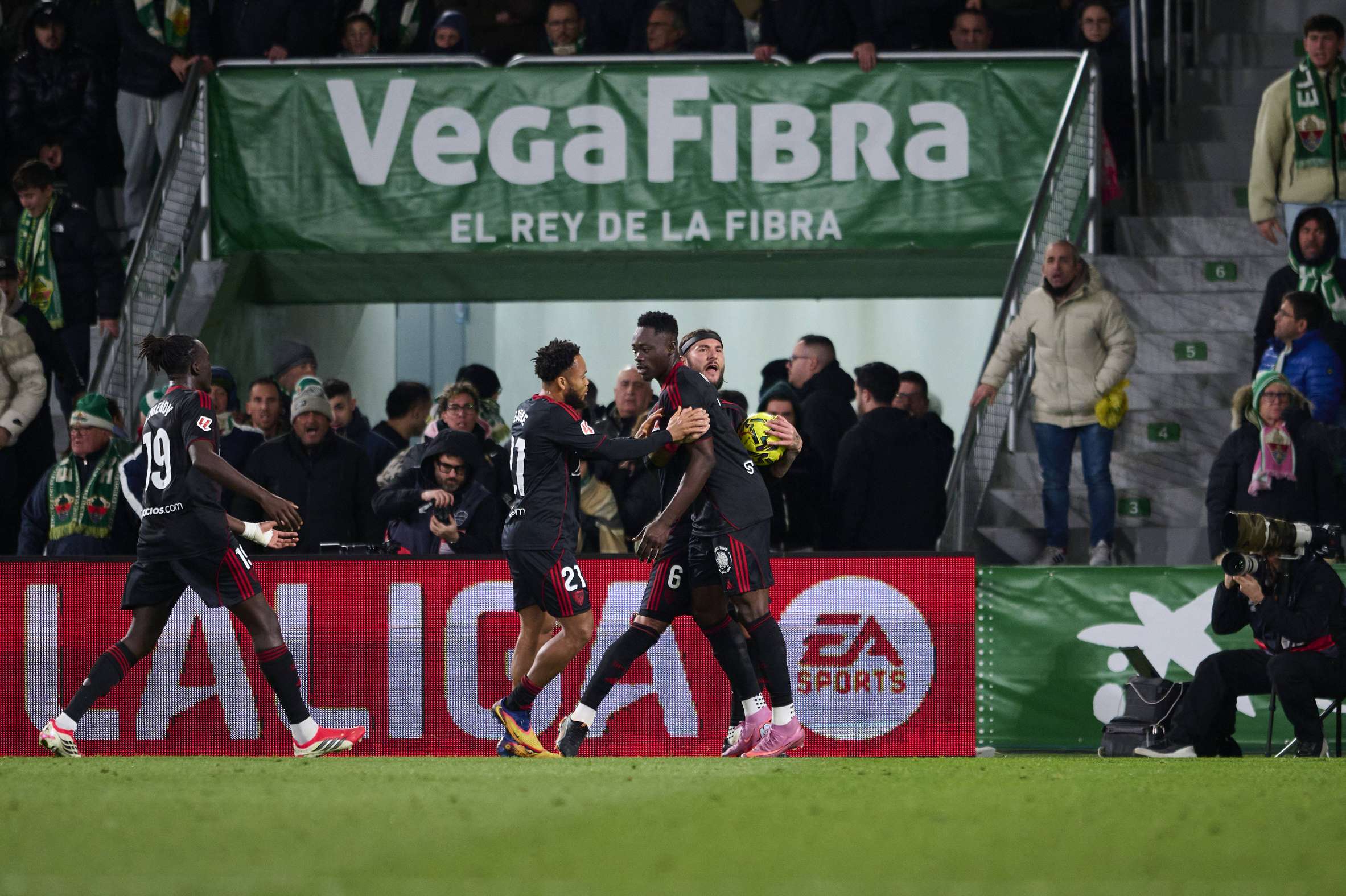 Akor Adams celebrates after scoring for Sevilla against Elche