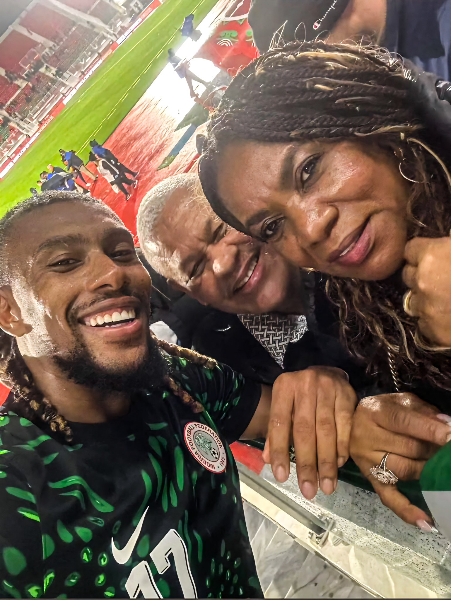Proud moments as Alex Iwobi poses with his parents who were in the stands after delivering an astonishing performance for Nigeria against Tanzania in the AFCON