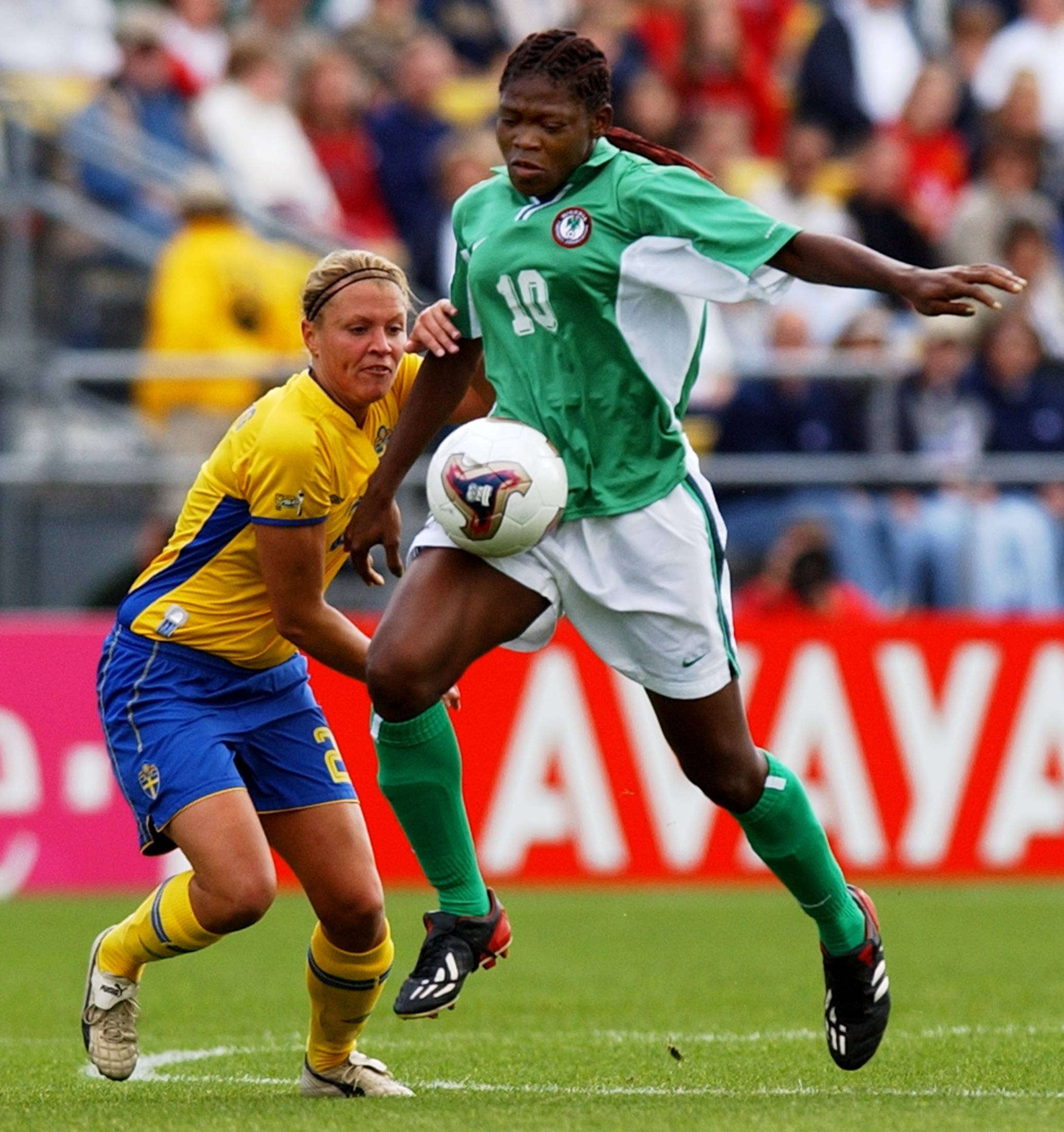 Sweden's Karolina Westberg battles Nigeria's Mercy Akide for a ball during the World Cup