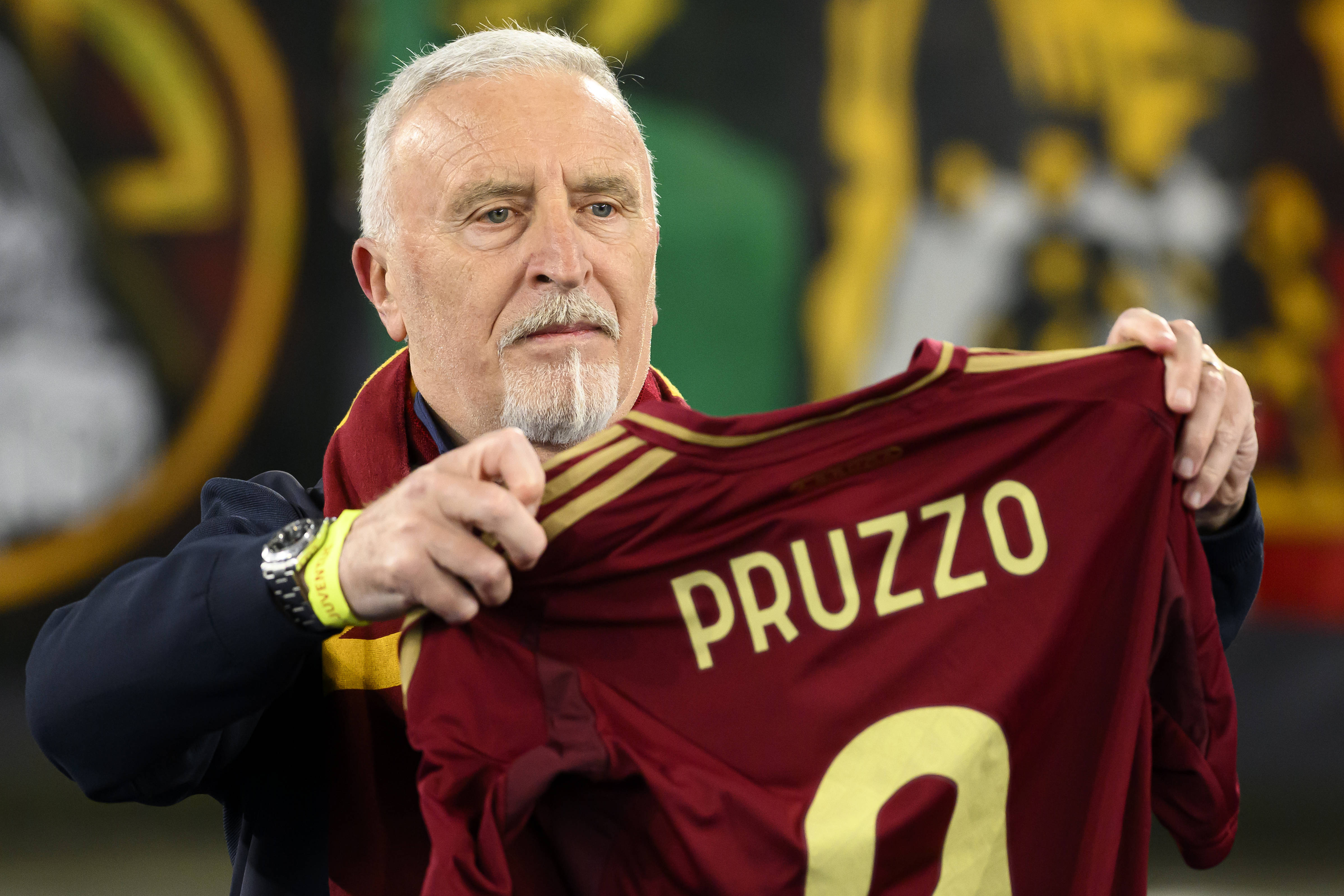 Former AS Roma player Roberto Pruzzo shows a shirt with his name during the Serie A football match between AS Roma and Juventus FC