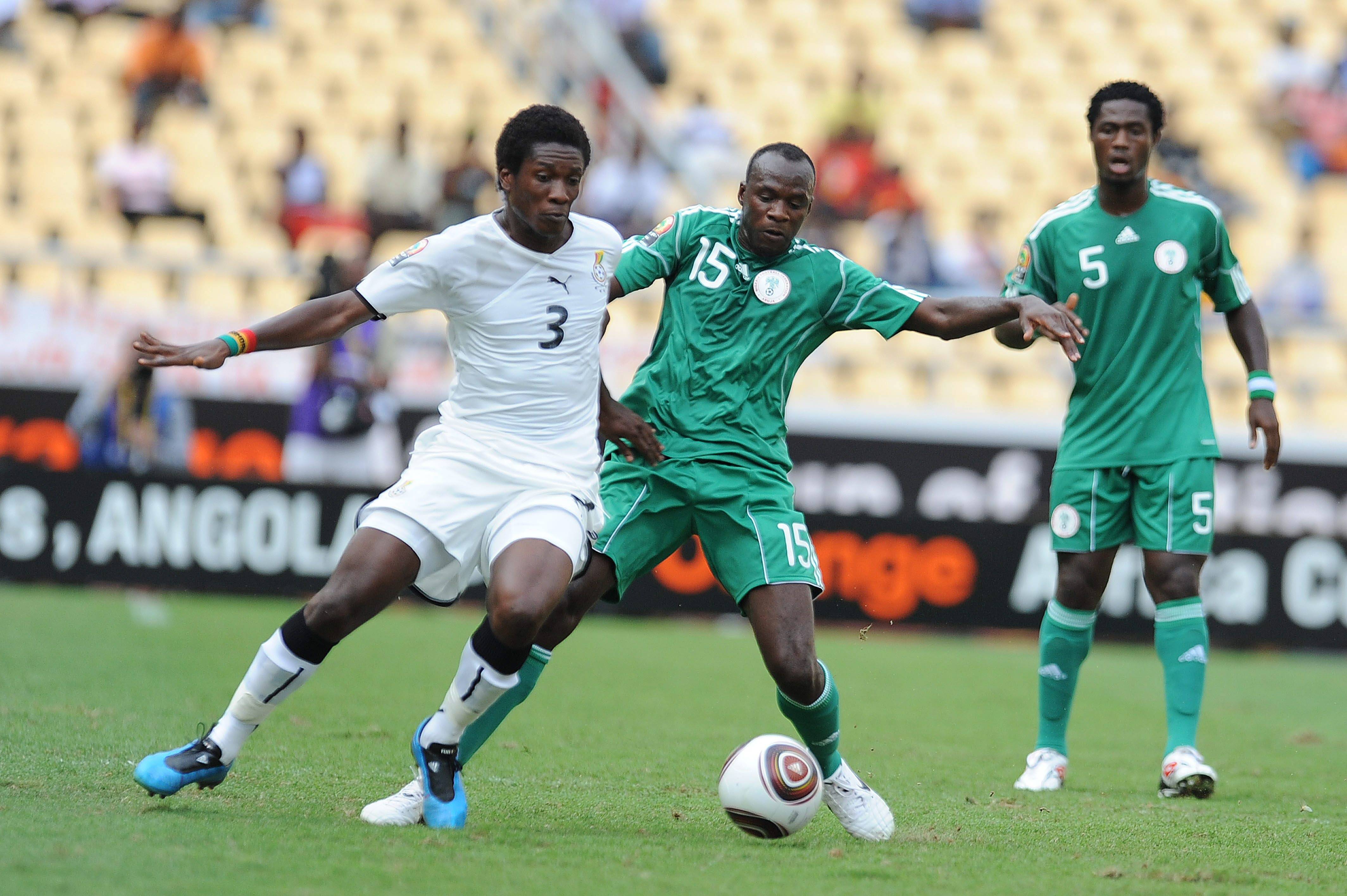 Asamoah Gyan and Sani Kaita during the Africa Cup of Nations semi-final match between Ghana and Nigeria 