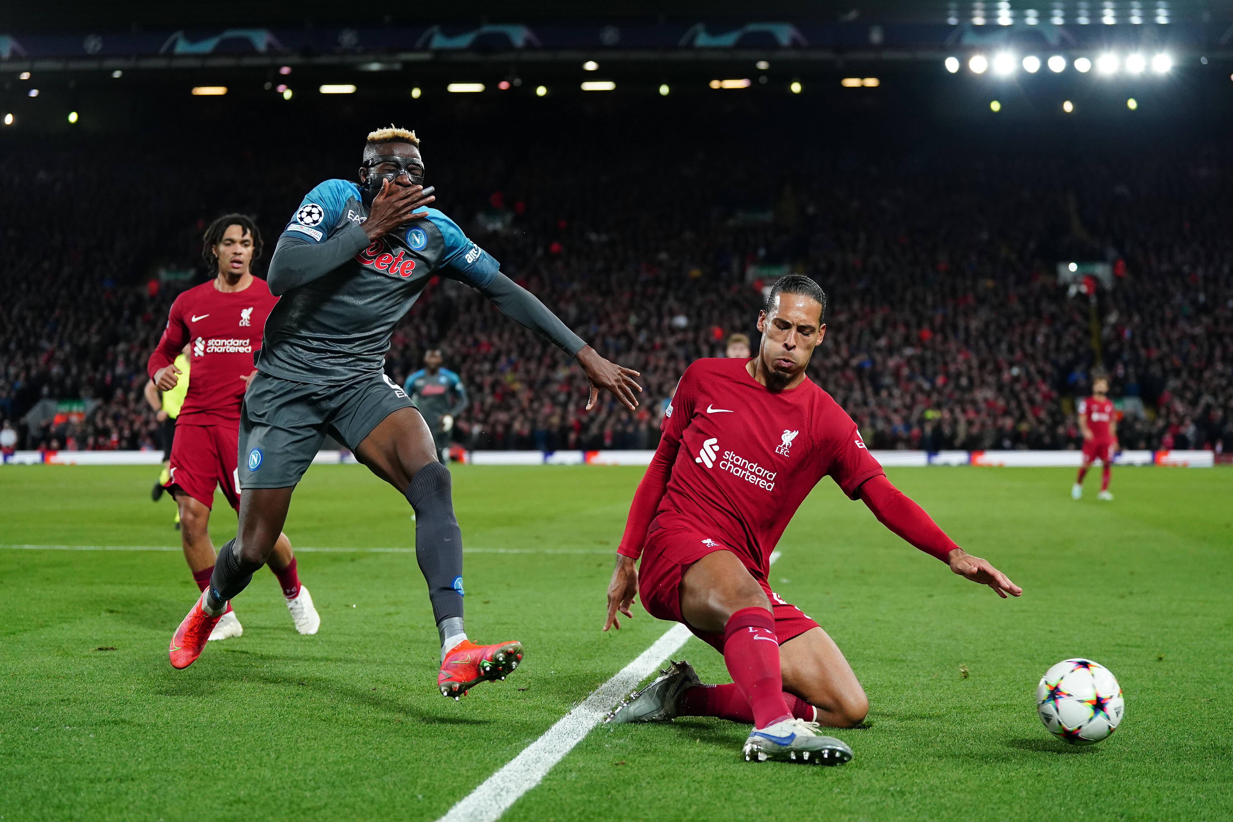 Victor Osimhen reacts after being caught in the face by Virgil van Dijk during the UEFA Champions League Group match at Anfield