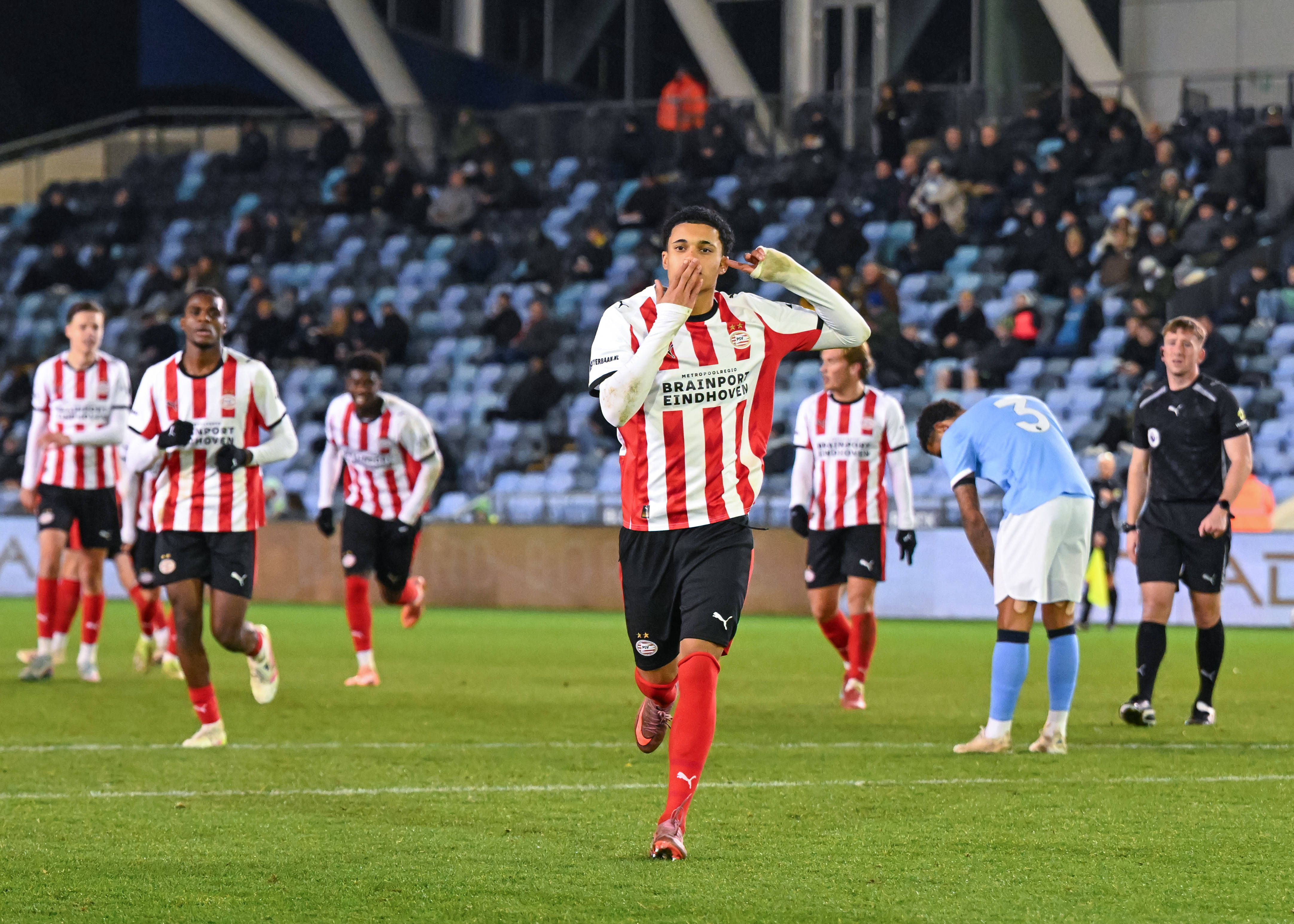 Ayodele Thomas of PSV Eindhoven celebrates scoring his sides second goal during the Manchester City