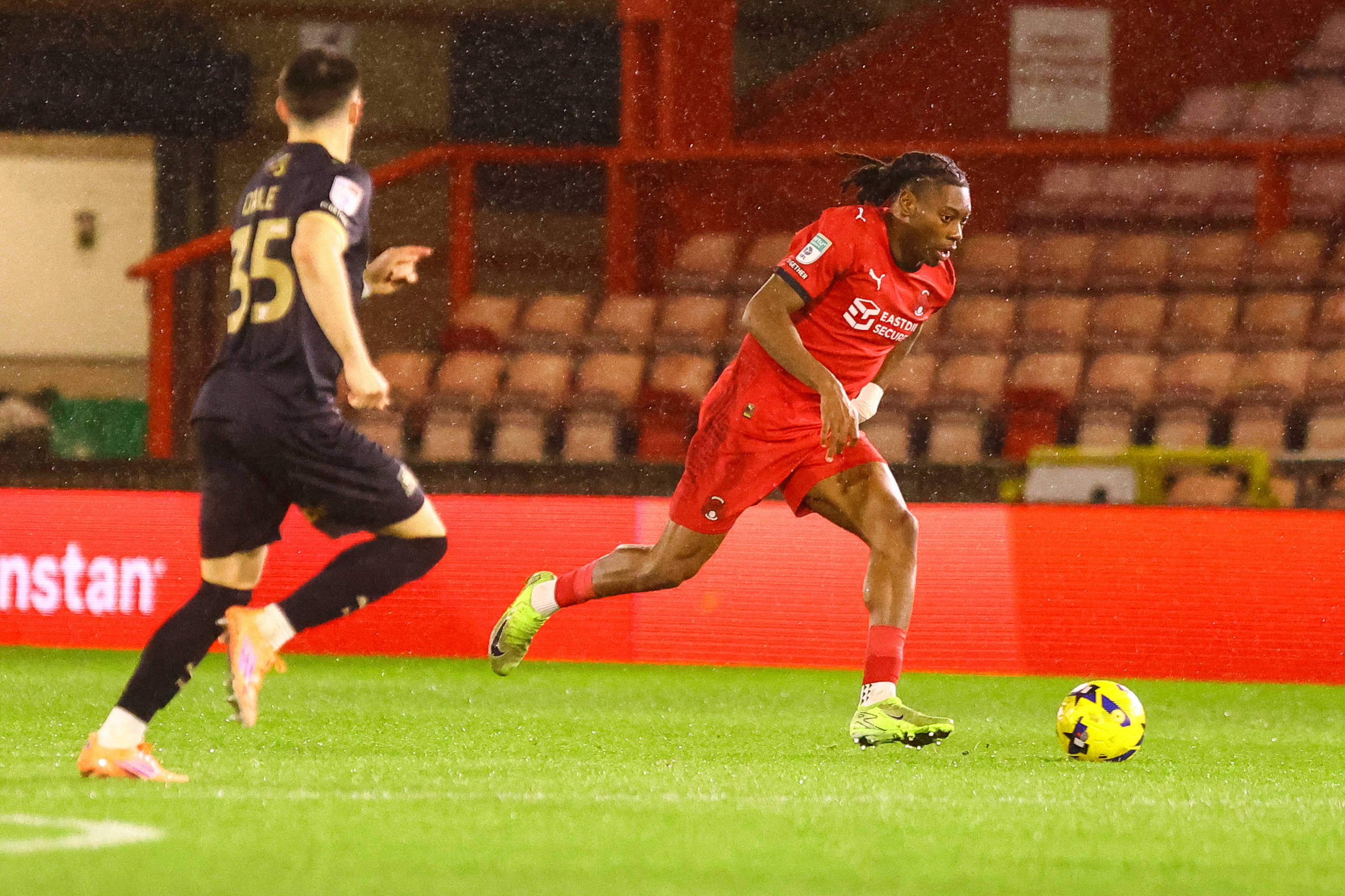 Tayo Adaramola on the ball during the Vertu Trophy round