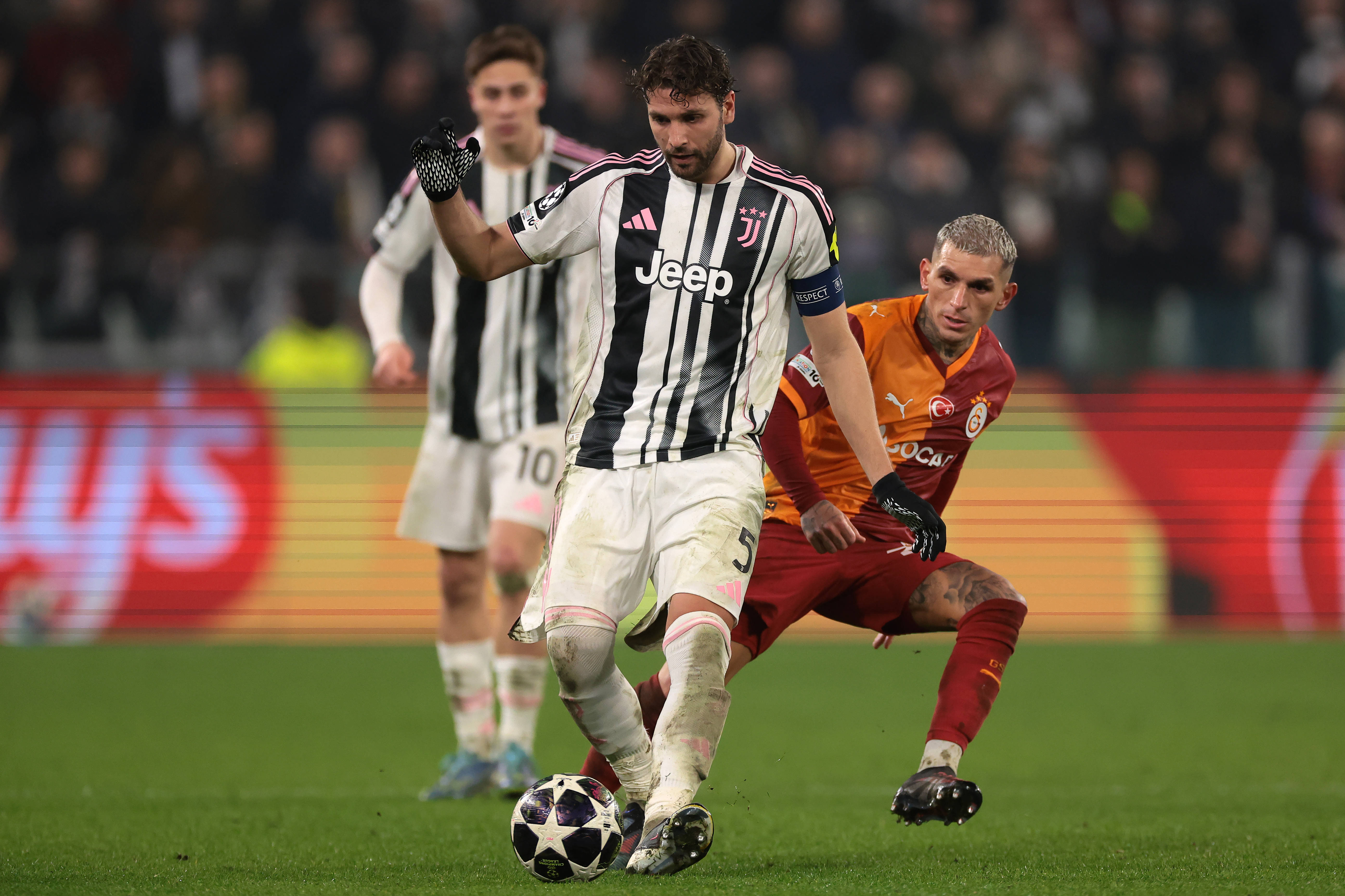 Manuel Locatelli of Juventus passes the ball as he is pursued by Lucas Torrerira of Galatasaray SK
