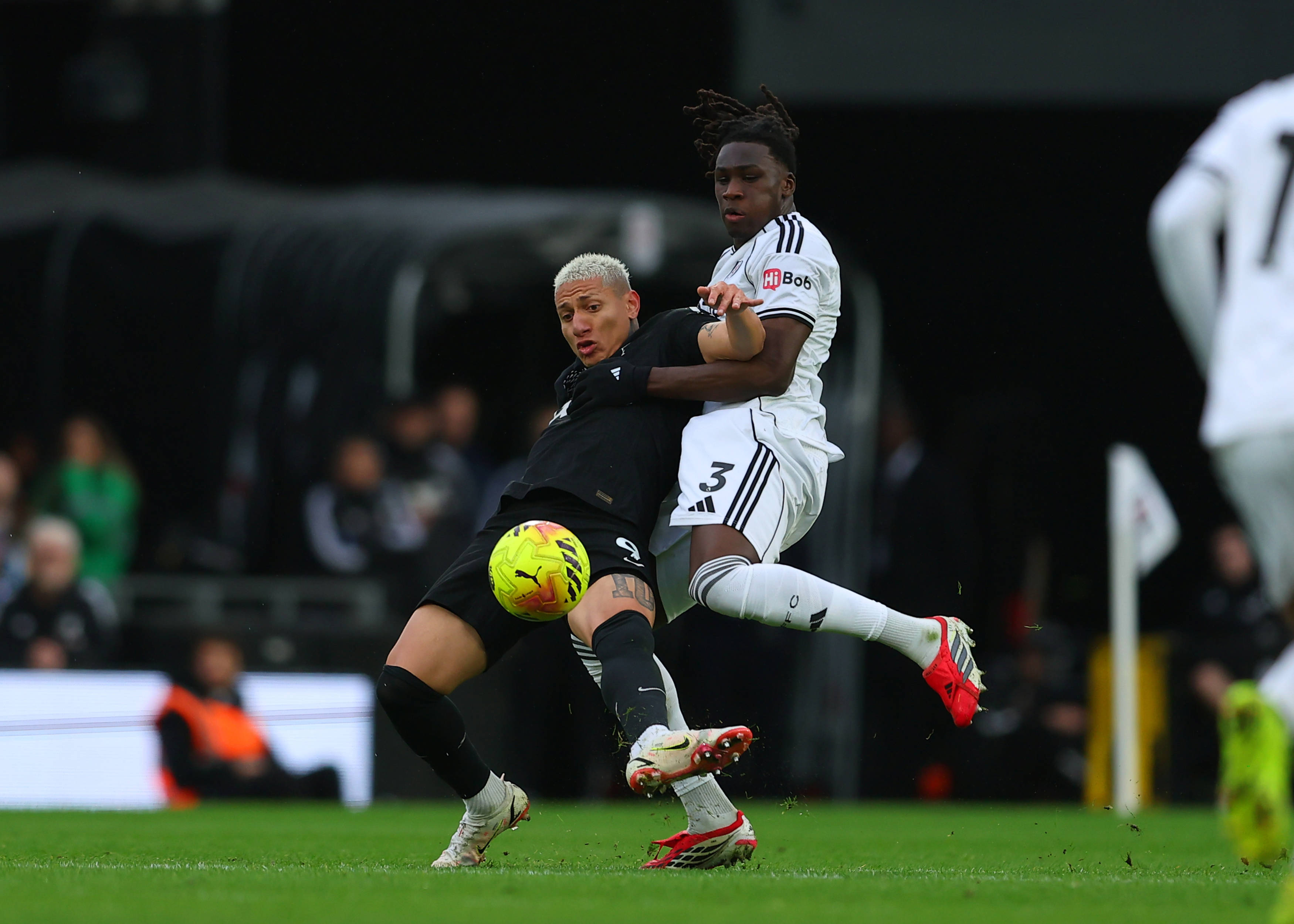 Richarlison under pressure from Calvin Bassey