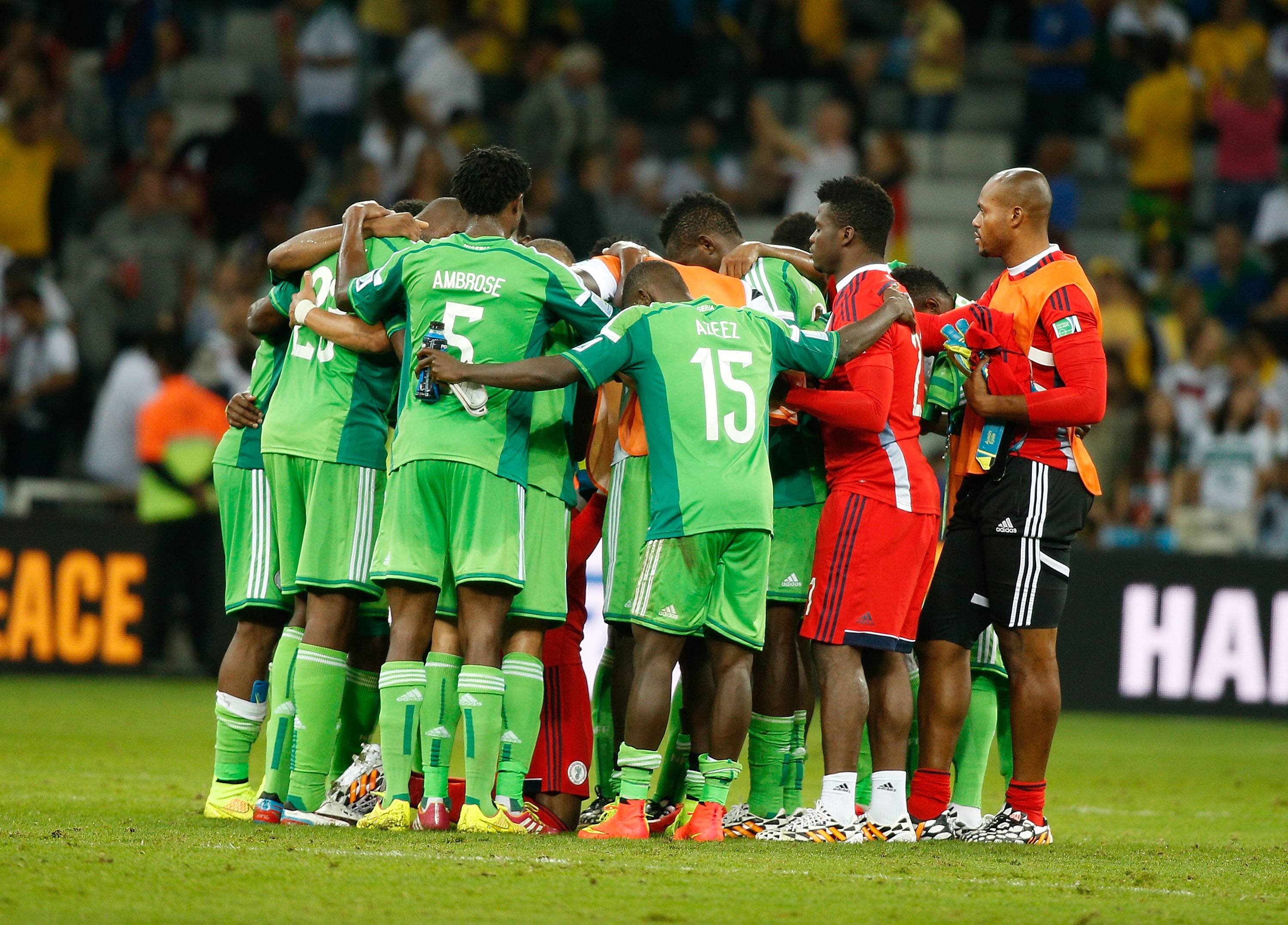 Players from Nigeria encourage each other after a Group F match between Iran and the Super Eagles at the 2014 FIFA World Cup at the Arena da Baixada Stadium in Curitiba, Brazil